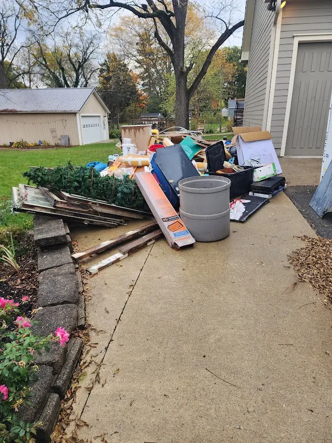 Dumpster being loaded with debris for 30 Yard Dumpster Rental in Johnson City